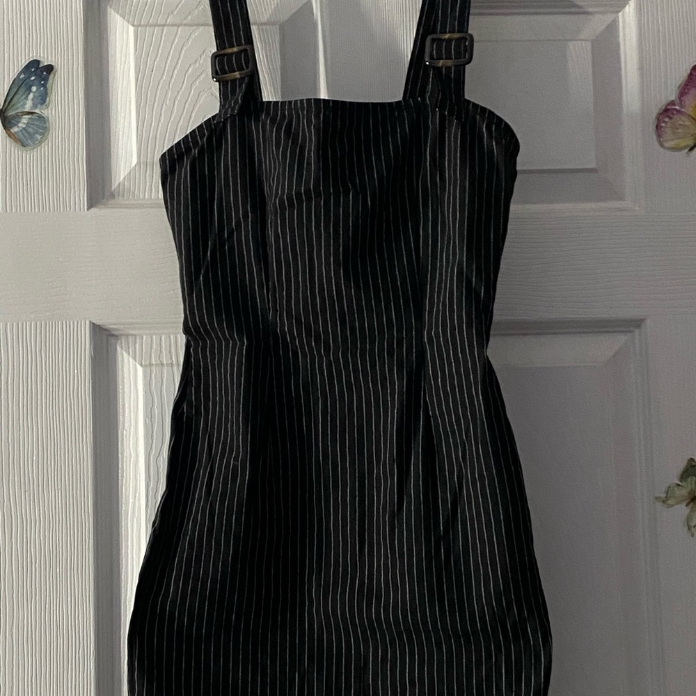 Little black dress with white stripes. Body fitting
